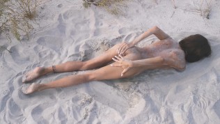 Amateur nudist teen fucks her tight pussy with a huge cucumber on a public beach. Ends with a pee.