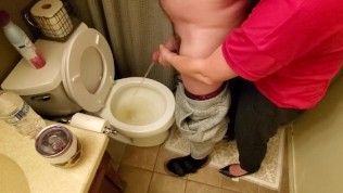 Helping my neighbor by holding his dick while he pees in the toilet while my boyfriend’s at work