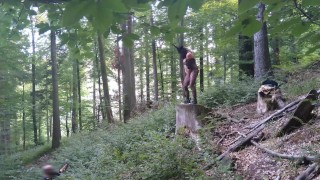I masturbate and stick a dildo in my pussy while standing on a wooden stump